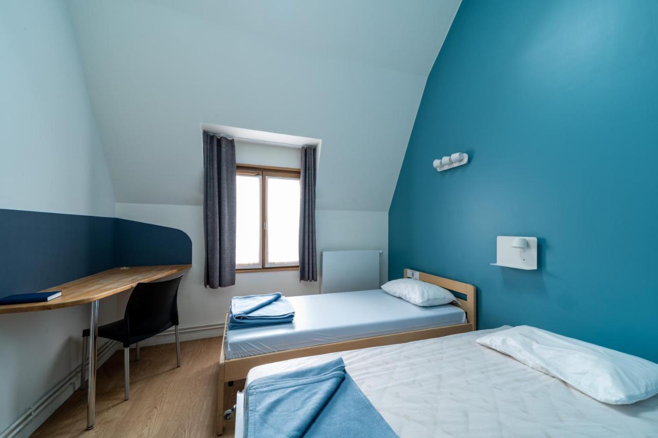 Bed in een Mannenslaapzaal met 3 Bedden